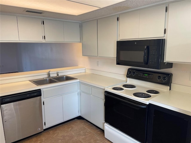 kitchen featuring electric stove, light countertops, a sink, black microwave, and dishwasher