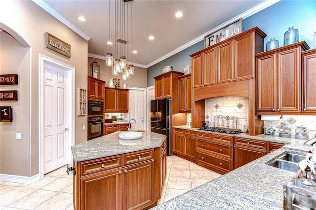 kitchen featuring backsplash, stainless steel gas cooktop, a kitchen island with sink, crown molding, and pendant lighting