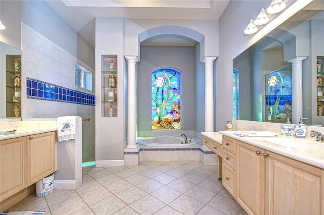 bathroom with tile patterned floors, vanity, and shower with separate bathtub