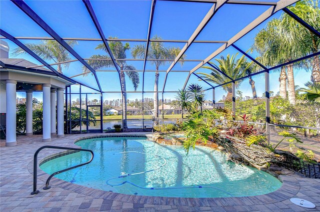 view of pool featuring a lanai and a patio area