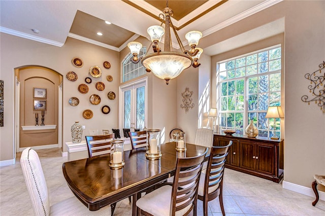 dining area featuring french doors, light tile patterned floors, an inviting chandelier, and crown molding