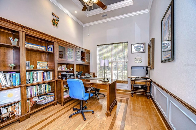 office space featuring ceiling fan, light hardwood / wood-style floors, and ornamental molding