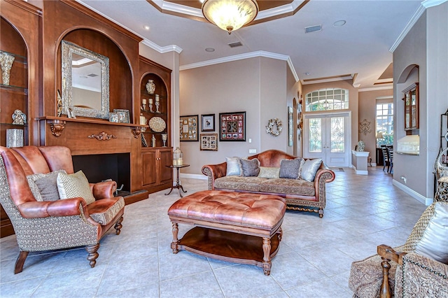 tiled living room featuring crown molding, a tray ceiling, and french doors