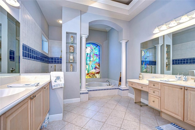 bathroom with tile patterned flooring, vanity, decorative columns, and separate shower and tub