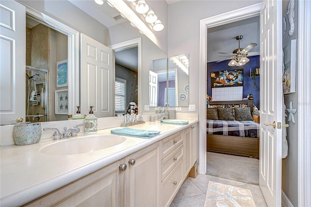 bathroom featuring tile patterned flooring, vanity, and ceiling fan