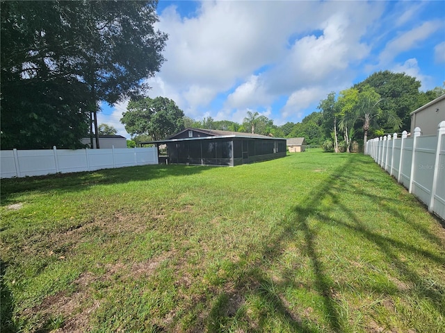 view of yard featuring a sunroom