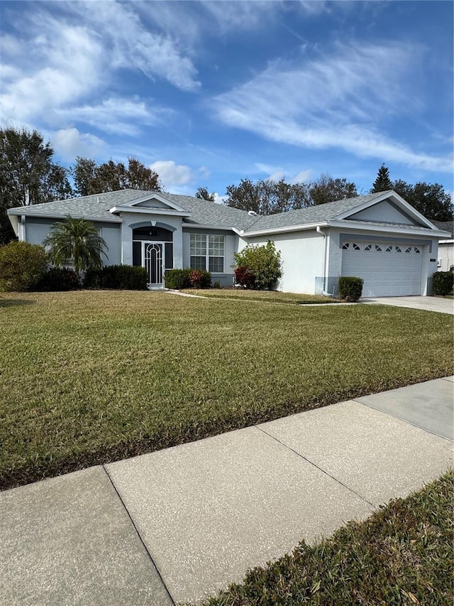 ranch-style house with a garage and a front yard