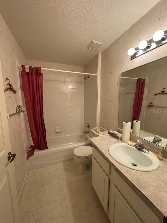 full bathroom featuring vanity, shower / bath combination with curtain, a textured ceiling, and toilet