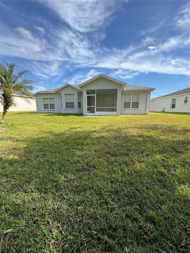 ranch-style house with a front lawn