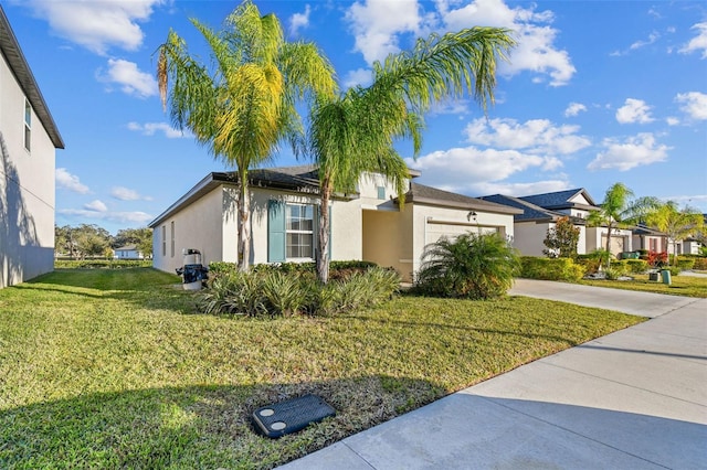 view of front of house featuring a garage and a front lawn