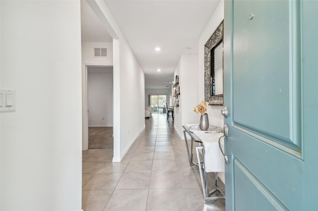 hallway with light tile patterned floors