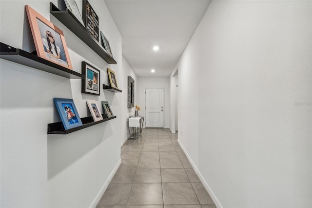 corridor with light tile patterned floors