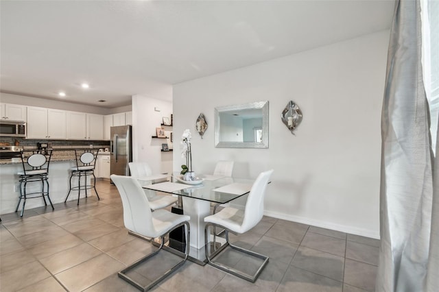 dining area featuring tile patterned floors