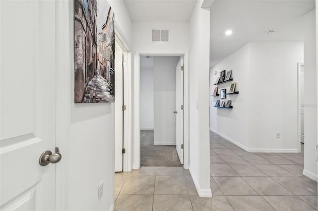 hall with light tile patterned flooring