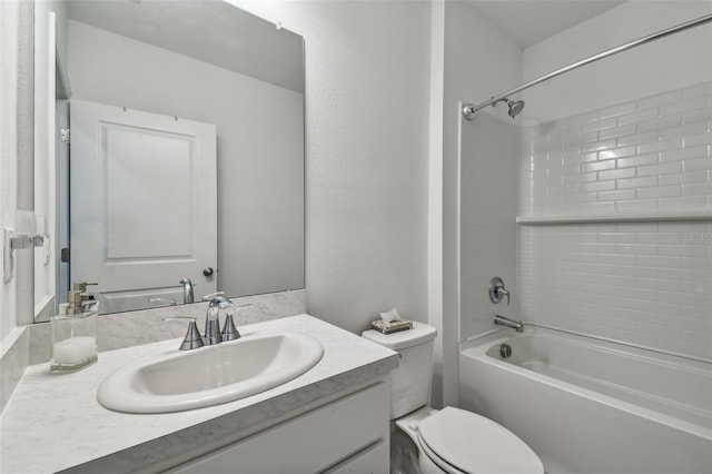 full bathroom featuring vanity, toilet, and tiled shower / bath