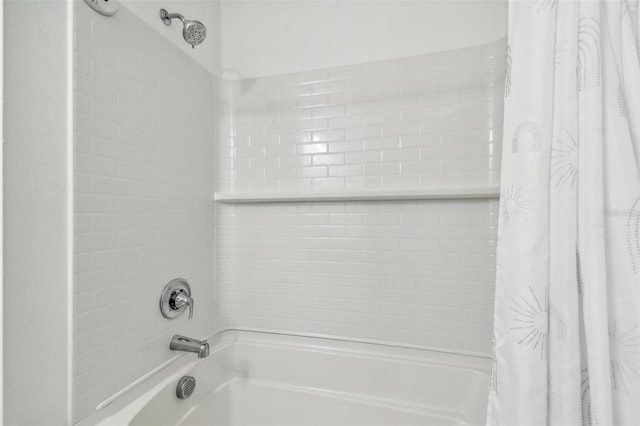 bathroom with shower / bathtub combination with curtain