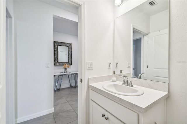 bathroom with vanity and tile patterned floors