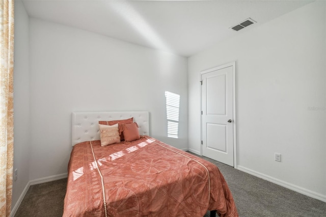 bedroom featuring dark colored carpet