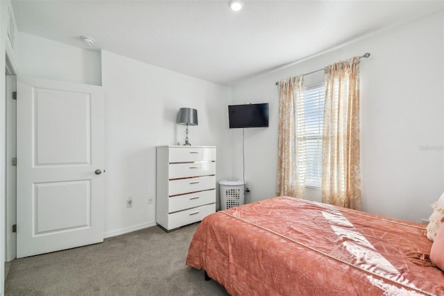 bedroom with light carpet