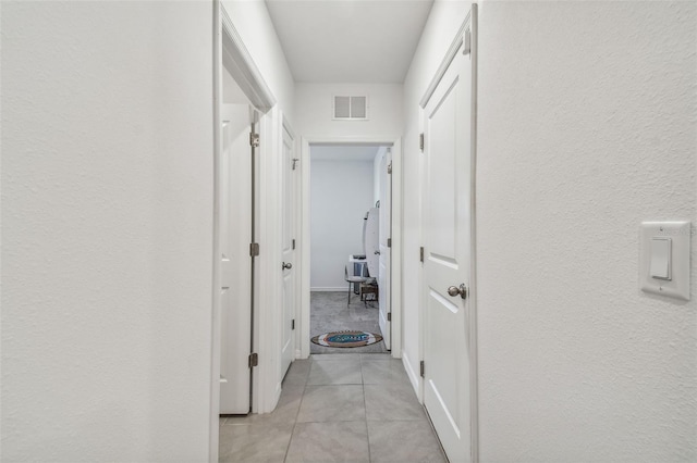 hallway with light tile patterned flooring