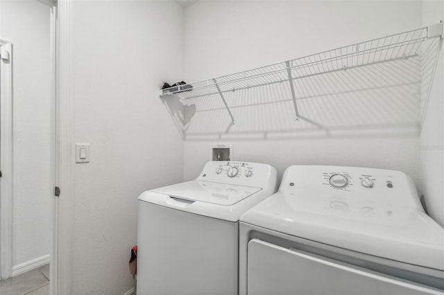 laundry room featuring separate washer and dryer