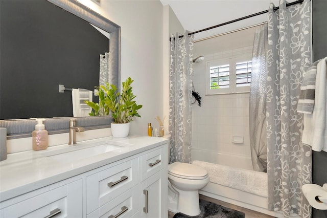 full bathroom with shower / bath combination with curtain, toilet, and vanity