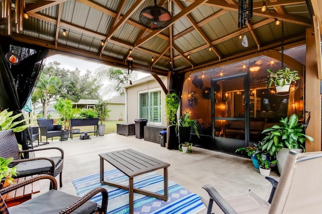 view of patio / terrace featuring a gazebo, an outdoor living space, and ceiling fan