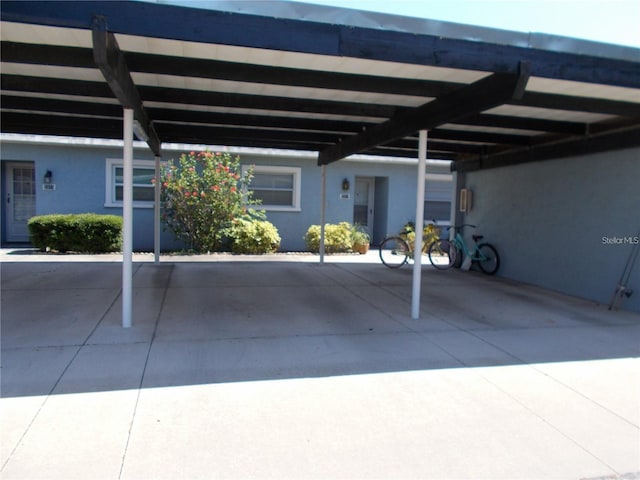 view of car parking featuring a carport