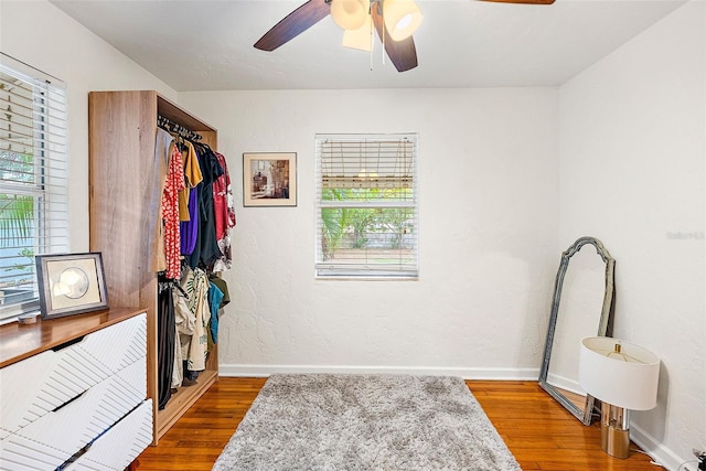 interior space featuring hardwood / wood-style floors and ceiling fan