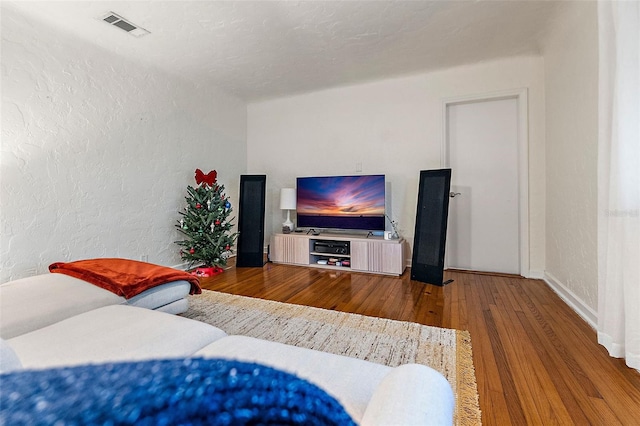 bedroom with wood-type flooring