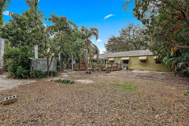 view of yard with a wooden deck