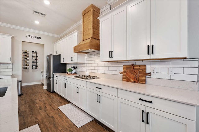 kitchen with white cabinets, custom range hood, dark hardwood / wood-style floors, and light stone counters