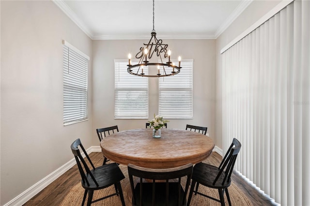 dining space with a notable chandelier, dark hardwood / wood-style floors, and ornamental molding