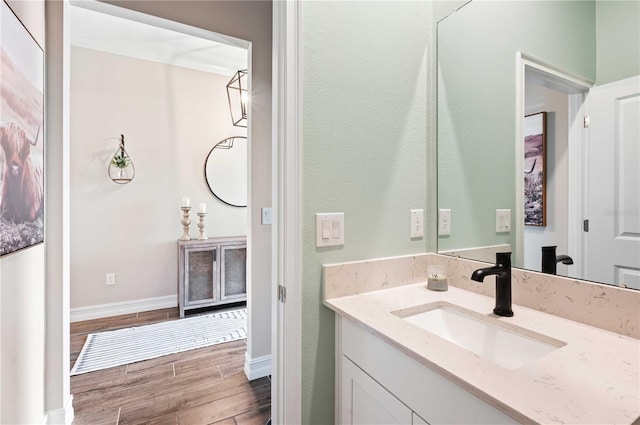 bathroom featuring hardwood / wood-style floors and vanity