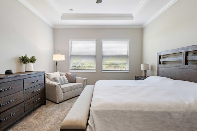 carpeted bedroom with a raised ceiling and ornamental molding