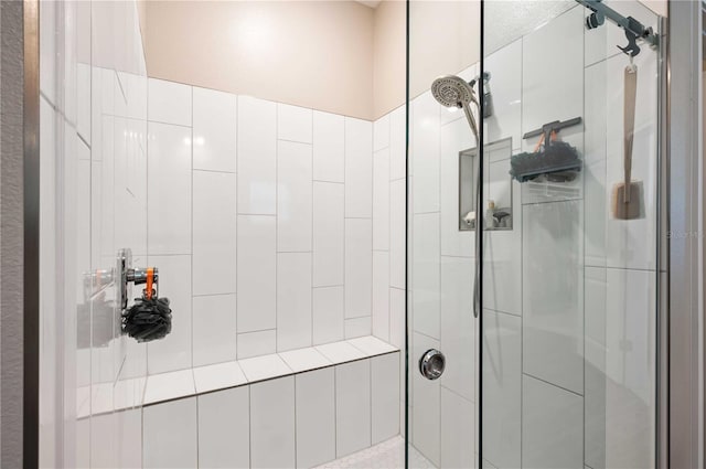 bathroom with a shower with shower door