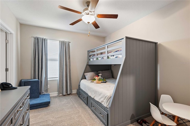 bedroom with light colored carpet and ceiling fan