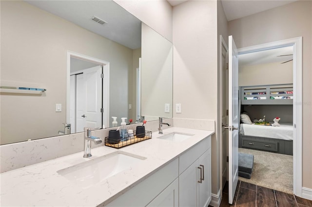 bathroom with hardwood / wood-style floors and vanity