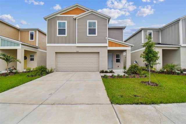 view of front of home featuring a garage and a front lawn