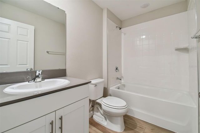 full bathroom with vanity, wood-type flooring, bathtub / shower combination, and toilet