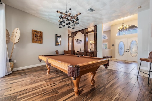 game room featuring french doors, hardwood / wood-style floors, and pool table