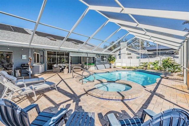 view of swimming pool featuring an in ground hot tub, outdoor lounge area, glass enclosure, and a patio area