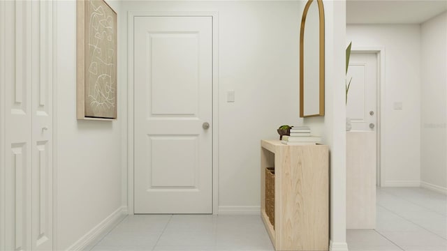 hall featuring light tile patterned floors