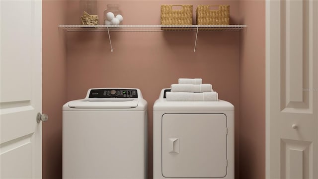 laundry area with independent washer and dryer