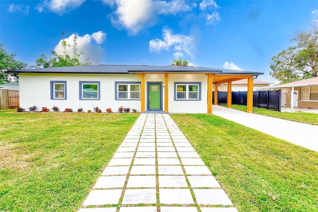 prairie-style house with a carport and a front lawn