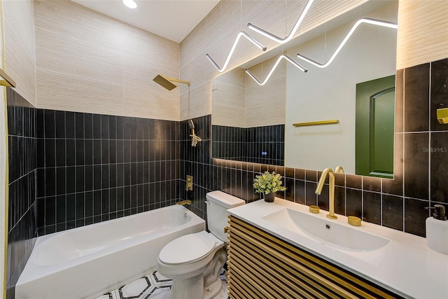 full bathroom featuring toilet, tasteful backsplash, tile walls, tiled shower / bath, and vanity