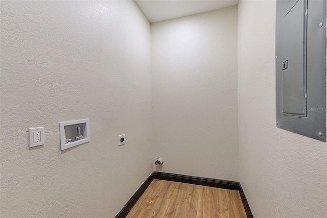 laundry room featuring electric panel, hookup for an electric dryer, hardwood / wood-style floors, and washer hookup