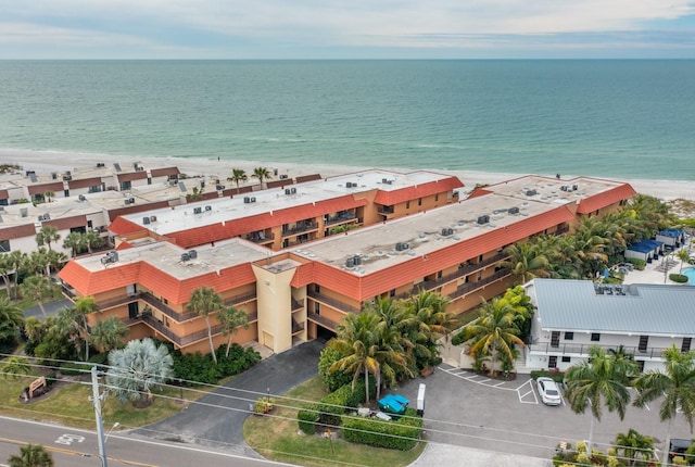 birds eye view of property with a view of the beach and a water view