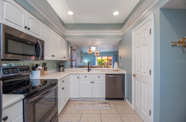 kitchen featuring white cabinets, sink, decorative backsplash, light tile patterned floors, and stainless steel appliances