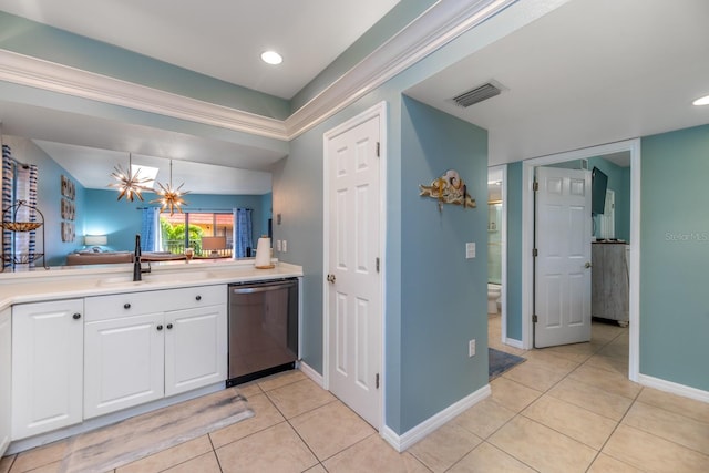 kitchen featuring stainless steel dishwasher, sink, light tile patterned floors, a chandelier, and white cabinetry